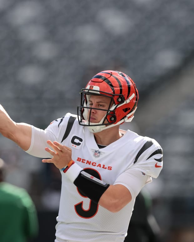 Oct 31, 2021; East Rutherford, New Jersey, USA; Cincinnati Bengals quarterback Joe Burrow (9) throws the ball before the game against the New York Jets at MetLife Stadium. Mandatory Credit: Vincent Carchietta-USA TODAY Sports