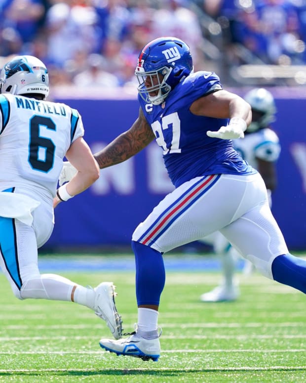 New York Giants defensive tackle Dexter Lawrence (97) chases down Carolina Panthers quarterback Baker Mayfield (6) in the first half of an NFL game at MetLife Stadium on Sunday, Sept. 18, 2022, in East Rutherford.