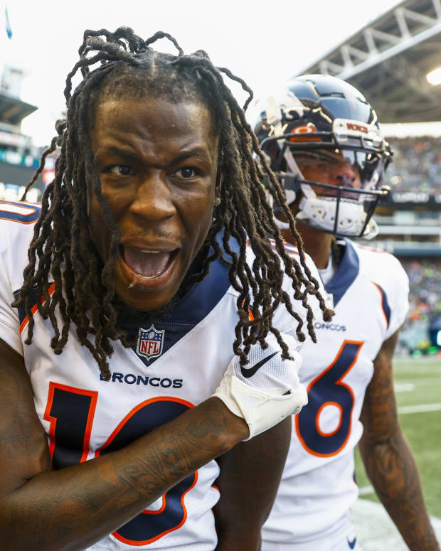 Denver Broncos wide receiver Jerry Jeudy (10) celebrates on the sideline after catching a touchdown pass against the Seattle Seahawks during the second quarter at Lumen Field.
