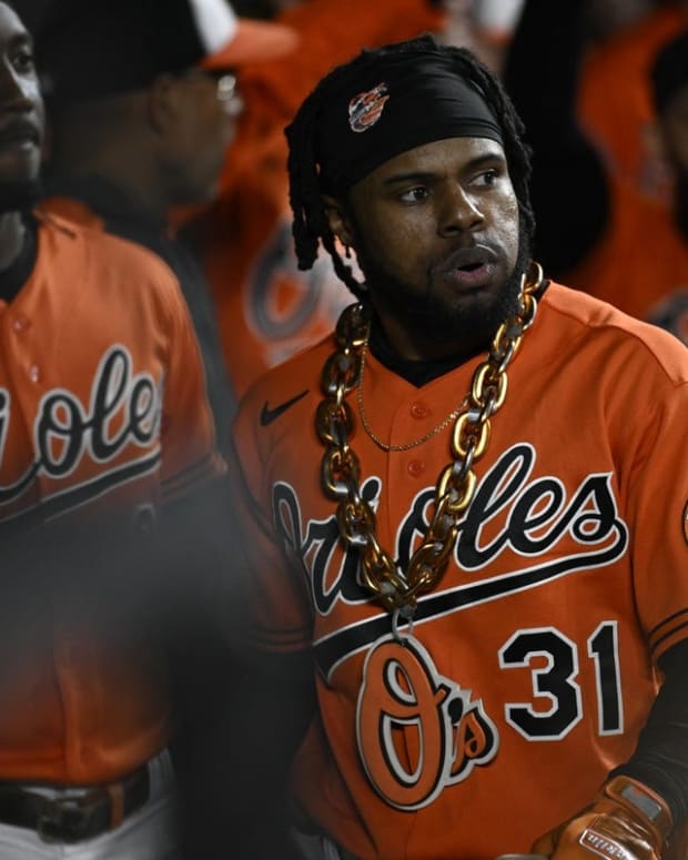 Sep 24, 2022; Baltimore, Maryland, USA; Baltimore Orioles center fielder Cedric Mullins (31) wears the home run chain in the dugout during the fourth inning against the Houston Astros at Oriole Park at Camden Yards. Mandatory Credit: James A. Pittman-USA TODAY Sports