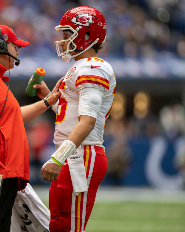 Sep 25, 2022; Indianapolis, Indiana, USA; Kansas City Chiefs head coach Andy Reid (left) talks with quarterback Patrick Mahomes (15) during the second quarter against the Indianapolis Colts at Lucas Oil Stadium. Mandatory Credit: Marc Lebryk-USA TODAY Sports