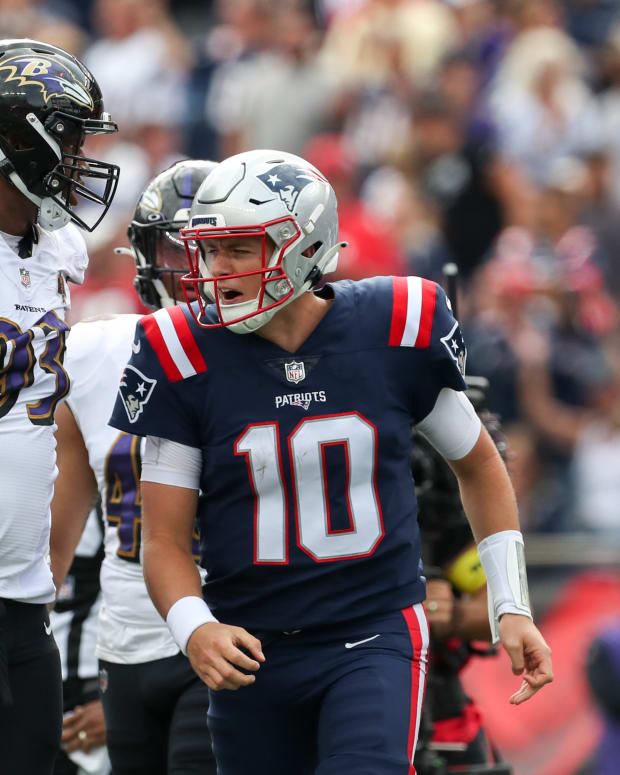 Sep 25, 2022; Foxborough, Massachusetts, USA; New England Patriots quarterback Mac Jones (10) reacts after scoring a touchdown during the first half against the Baltimore Ravens at Gillette Stadium.