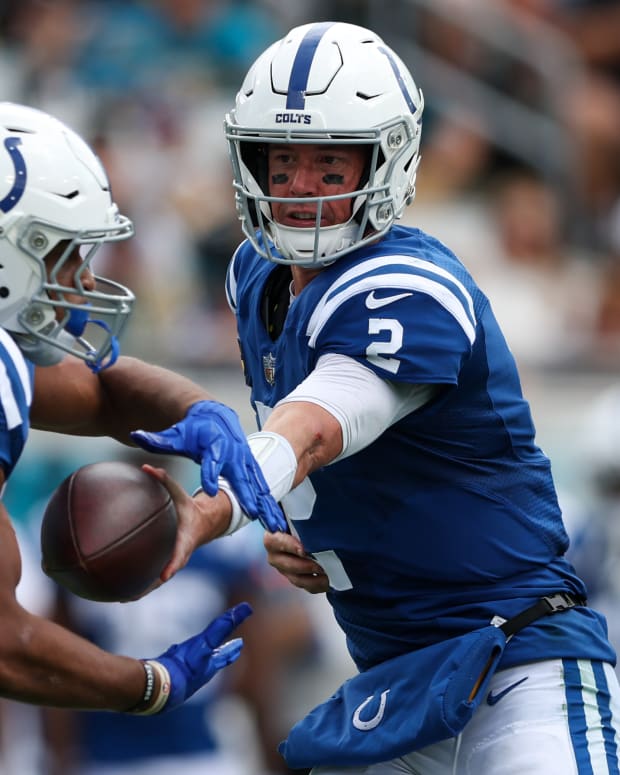 Sep 18, 2022; Jacksonville, Florida, USA; Indianapolis Colts quarterback Matt Ryan (2) hands off to running back Jonathan Taylor (28) in the third quarter at TIAA Bank Field.