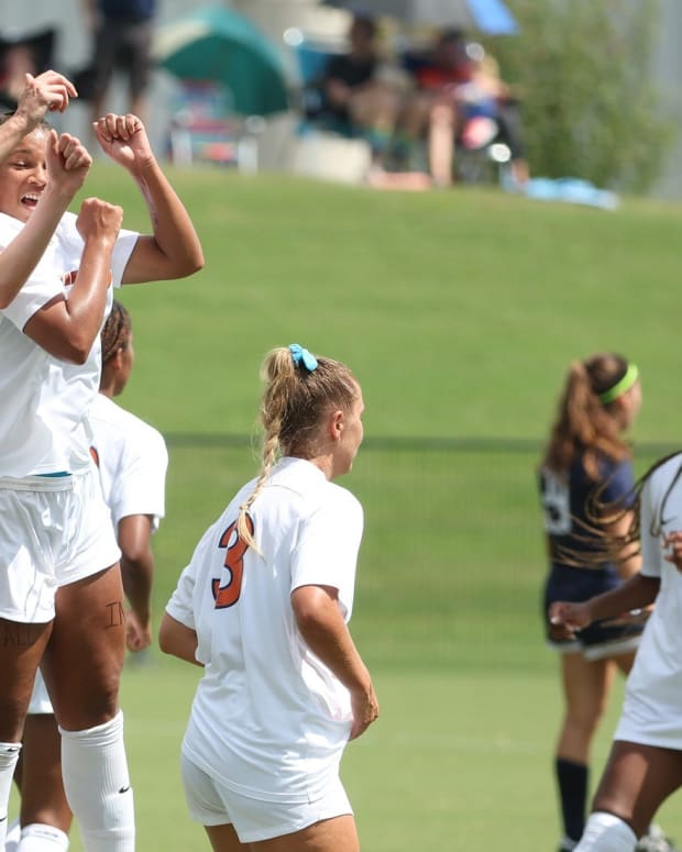 Haley Hopkins celebrates after scoring a goal for the Virginia women's soccer team.