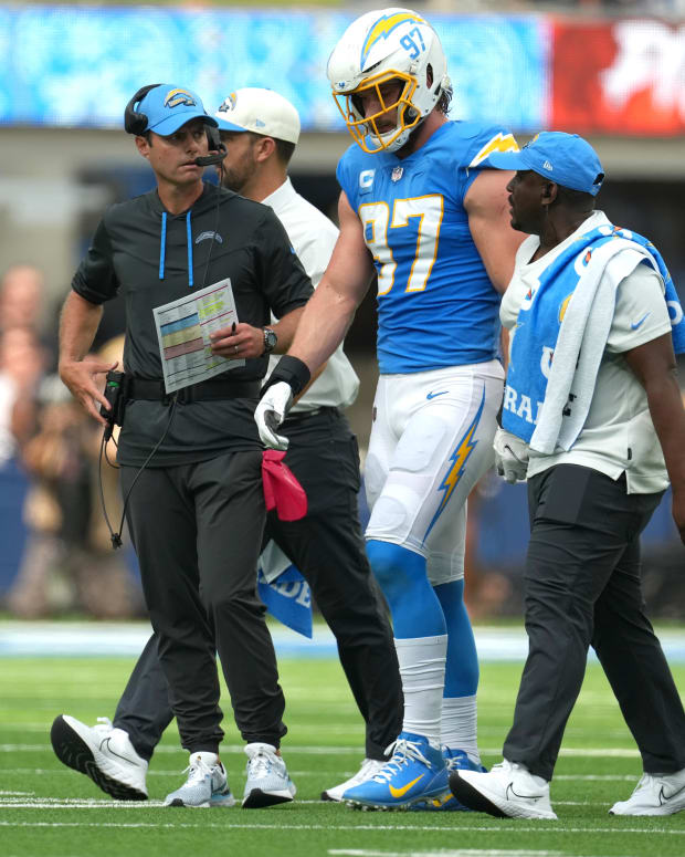 Sep 25, 2022; Inglewood, California, USA; Los Angeles Chargers linebacker Joey Bosa (97) walks off the field with Brandon Staley after suffering an injury against the Jacksonville Jaguars in the first half at SoFi Stadium. Mandatory Credit: Kirby Lee-USA TODAY Sports