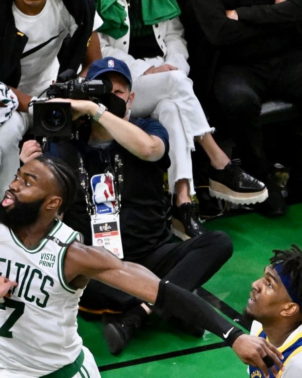 Jaylen Brown tries to block a shot by Stephen Curry in the NBA Finals.