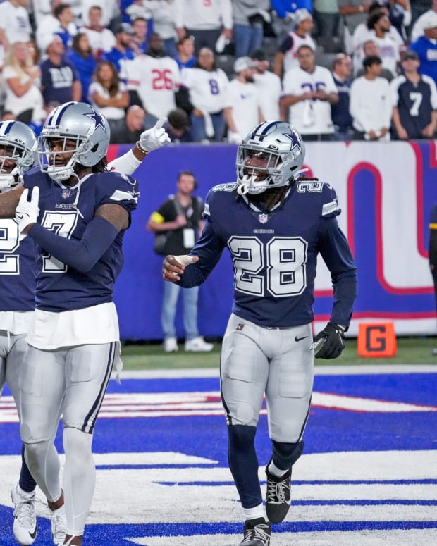 Sep 26, 2022; East Rutherford, NJ, USA; Dallas Cowboys cornerback Trevon Diggs (7) celebrates with teammates after making an interception during the fourth quarter against the New York Giants at MetLife Stadium.