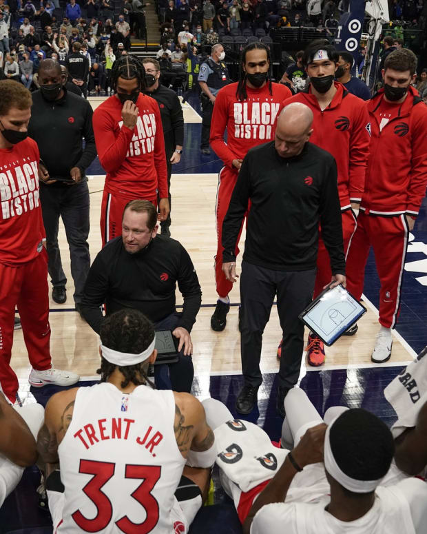 Toronto Raptors head coach Nick Nurse (center) speaks to his players during a first quarter timeout against the Minnesota Timberwolves at Target Center