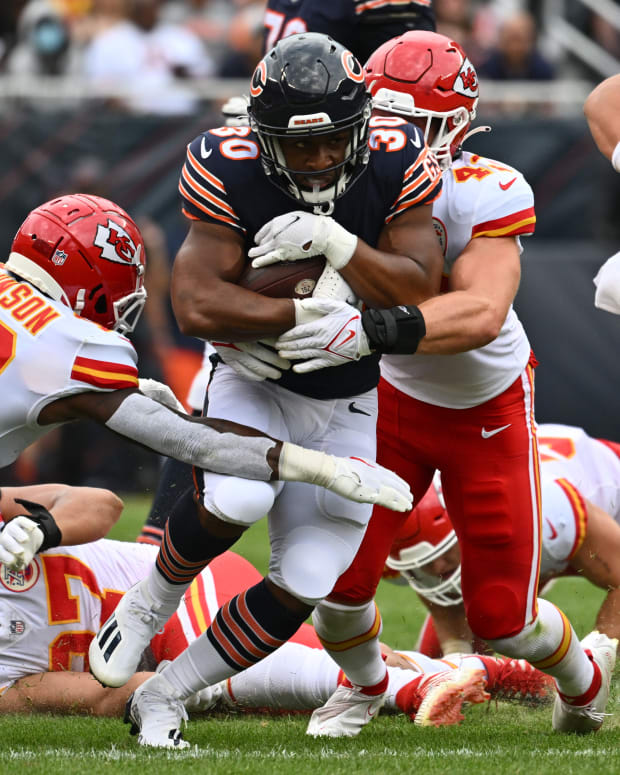 Aug 13, 2022; Chicago, Illinois, USA; Chicago Bears running back De'Montre Tuggle (30) picks up yardage in the third quarter as Kansas City Chiefs safety Nazeeh Johnson (13) and linebacker Jack Cochrane (43) move in for the tackle at Soldier Field. Chicago defeated Kansas City 19-14. Mandatory Credit: Jamie Sabau-USA TODAY Sports