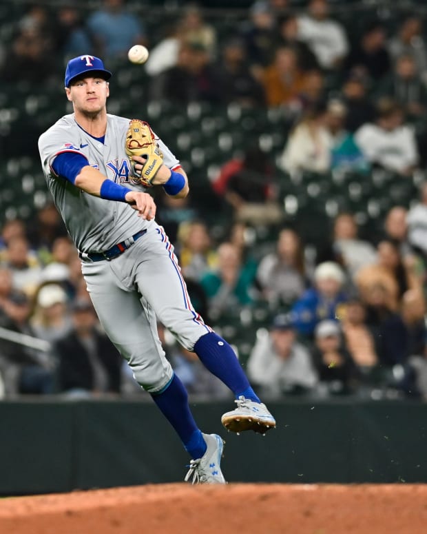 Sep 28, 2022; Seattle, Washington, USA; Texas Rangers third baseman Josh Jung (6) throws the ball to first base for an out against Seattle Mariners third baseman Ty France (not pictured) during the fifth inning at T-Mobile Park. Mandatory Credit: Steven Bisig-USA TODAY Sports