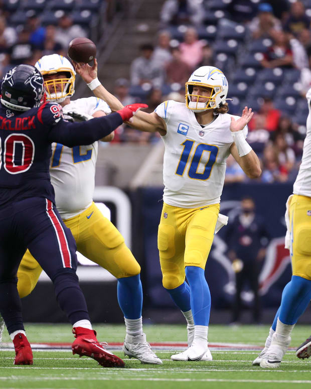 Dec 26, 2021; Houston, Texas, USA; Los Angeles Chargers quarterback Justin Herbert (10) attempts a pass during the first quarter against the Houston Texans at NRG Stadium. Mandatory Credit: Troy Taormina-USA TODAY Sports