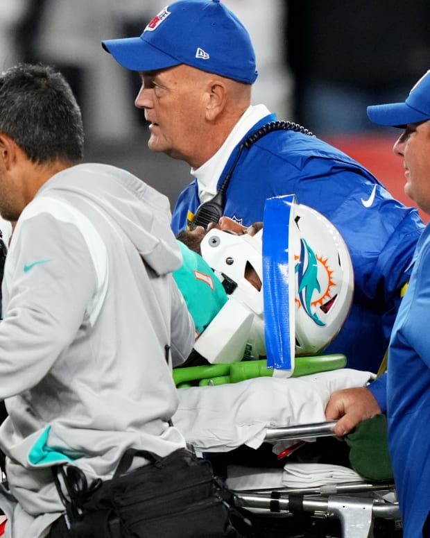 Miami Dolphins quarterback Tua Tagovailoa (1) is taken off the field after suffering a head injury following a sack by Cincinnati Bengals defensive tackle Josh Tupou (not pictured) in the second quarter at Paycor Stadium in Cincinnati.