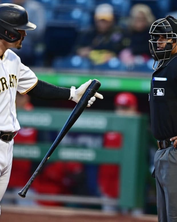 Sep 27, 2022; Pittsburgh, Pennsylvania, USA; Pittsburgh Pirates center fielder Bryan Reynolds (10) argues with home plate umpire Erich Bacchus after striking out during the first inning against the Cincinnati Reds at PNC Park. Mandatory Credit: David Dermer-USA TODAY Sports