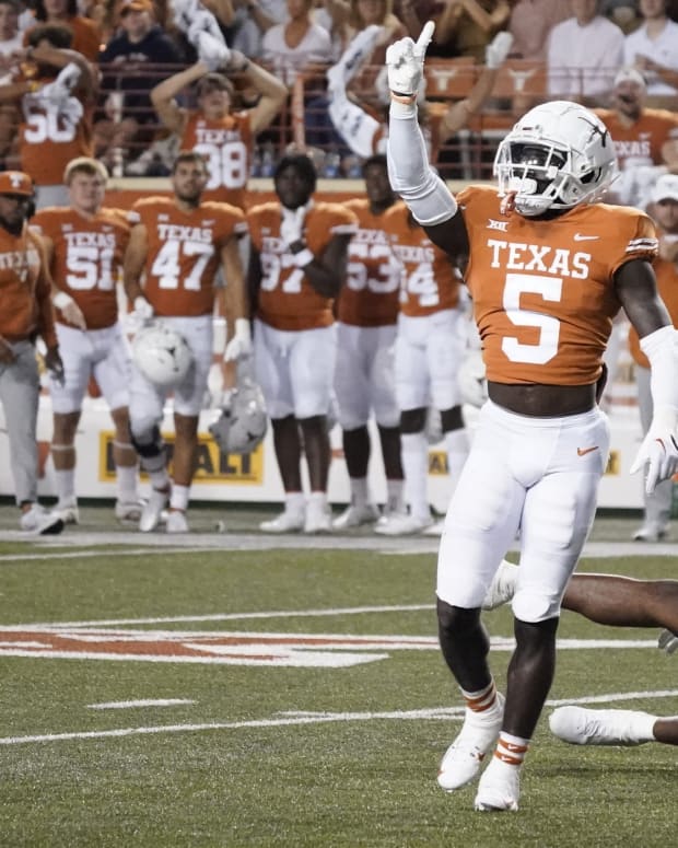 Oct 1, 2022; Austin, Texas, USA; Texas Longhorns defensive back D'Shawn Jamison (5) reacts after breaking up a pass intended for West Virginia Mountaineers wide receiver Bryce Ford-Wheaton (0) during the first half at Darrell K Royal-Texas Memorial Stadium.