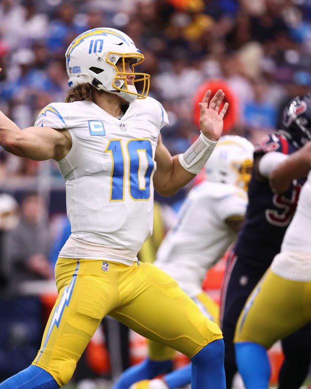 Dec 26, 2021; Houston, Texas, USA; Los Angeles Chargers quarterback Justin Herbert (10) attempts a pass during the second quarter against the Houston Texans at NRG Stadium. Mandatory Credit: Troy Taormina-USA TODAY Sports