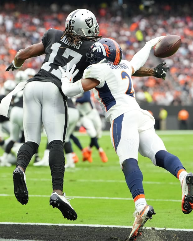 Denver Broncos cornerback Pat Surtain II (2) breaks up a pass intended for Las Vegas Raiders wide receiver Davante Adams (17) during a game at Allegiant Stadium.