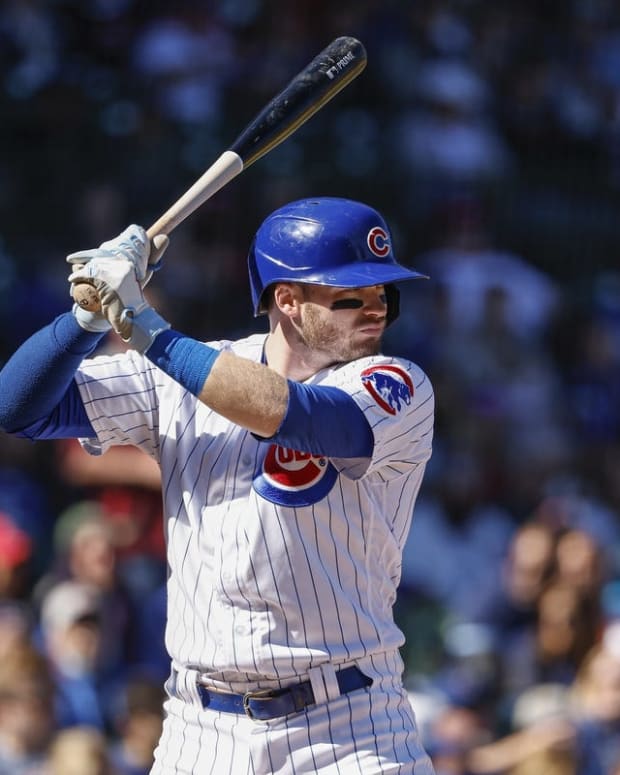 Oct 1, 2022; Chicago, Illinois, USA; Chicago Cubs left fielder Ian Happ (8) bats against the Cincinnati Reds during the first inning at Wrigley Field. Mandatory Credit: Kamil Krzaczynski-USA TODAY Sports