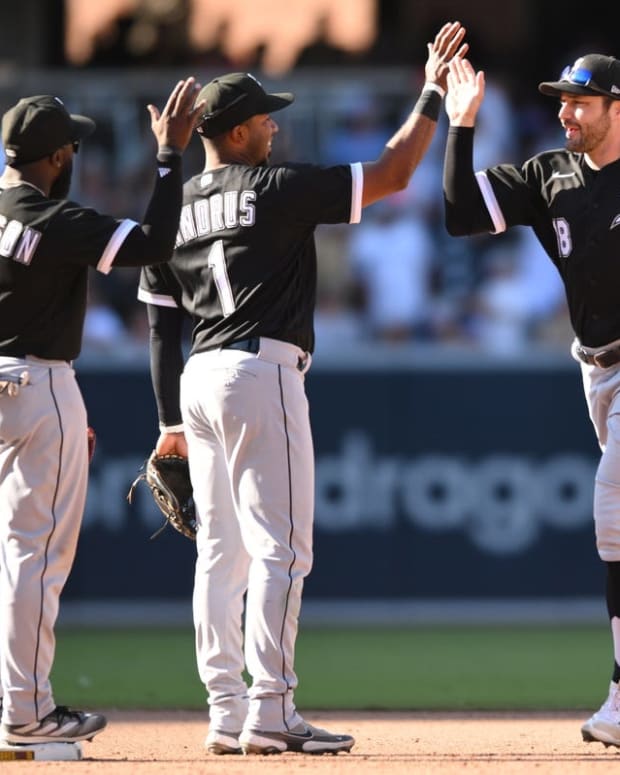 Oct 2, 2022; San Diego, California, USA; Chicago White Sox center fielder A.J. Pollock (18) celebrates with second baseman Elvis Andrus (1) and second baseman Josh Harrison (5) after defeating the San Diego Padres at Petco Park. Mandatory Credit: Orlando Ramirez-USA TODAY Sports