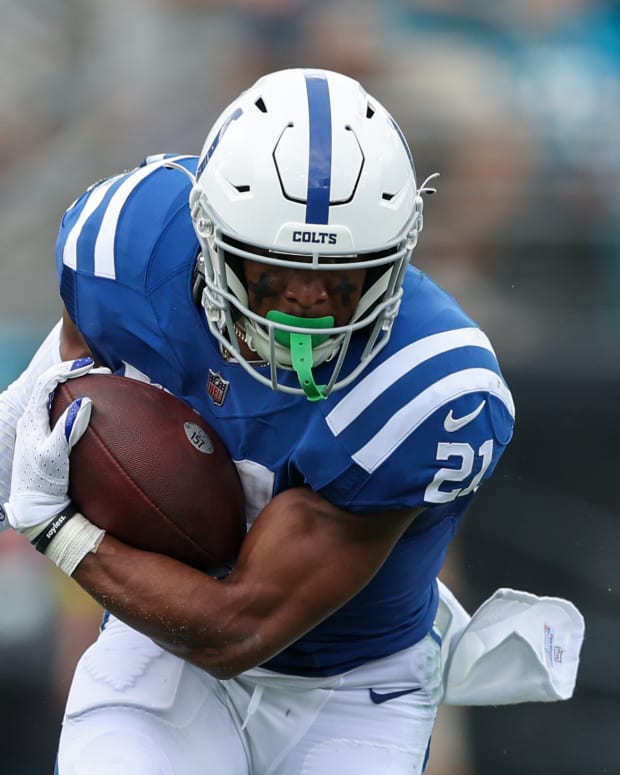 Sep 18, 2022; Jacksonville, Florida, USA; Indianapolis Colts running back Nyheim Hines (21) runs with the ball against the Jacksonville Jaguars in the first quarter at TIAA Bank Field.