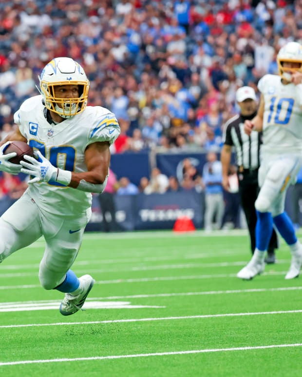 Oct 2, 2022; Houston, Texas, USA; Los Angeles Chargers running back Austin Ekeler (30) runs for a touchdown during the fourth quarter against the Houston Texans at NRG Stadium. Mandatory Credit: Kevin Jairaj-USA TODAY Sports