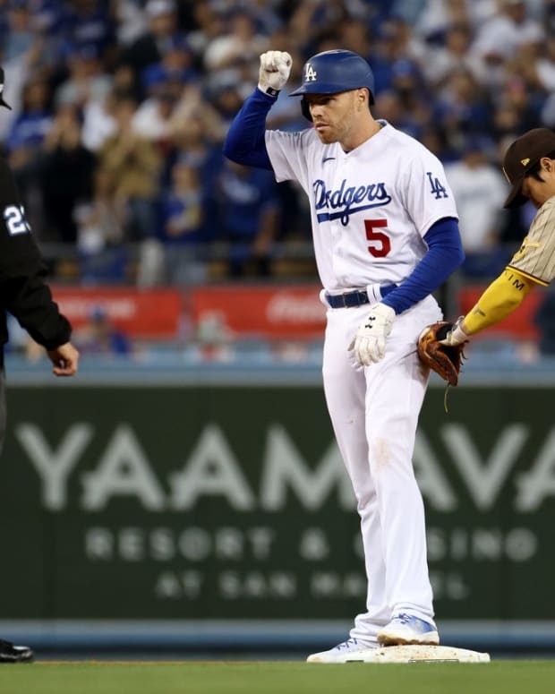 Oct 12, 2022; Los Angeles, California, USA; Los Angeles Dodgers first baseman Freddie Freeman (5) reacts after hitting a double in the ninth inning of game two of the NLDS for the 2022 MLB Playoffs against the San Diego Padres at Dodger Stadium. Mandatory Credit: Kiyoshi Mio-USA TODAY Sports