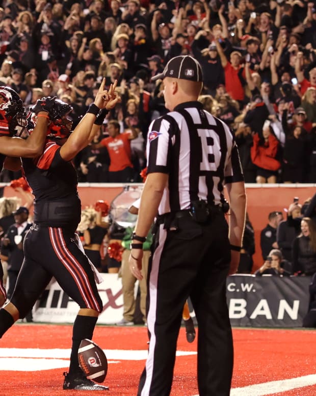 Utah Utes quarterback Cameron Rising (7) celebrates scoring a two-point conversation to take a one point lead against the USC Trojans in the final minute of the game at Rice-Eccles Stadium.