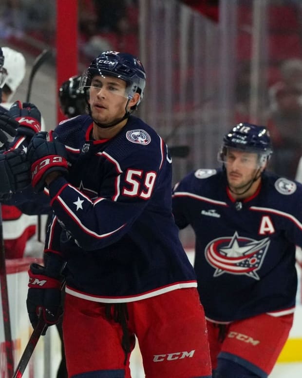 Oct 3, 2022; Raleigh, North Carolina, USA; Columbus Blue Jackets right wing Yegor Chinakhov (59) celebrates his goal against the Carolina Hurricanes during the first period at PNC Arena. Mandatory Credit: James Guillory-USA TODAY Sports