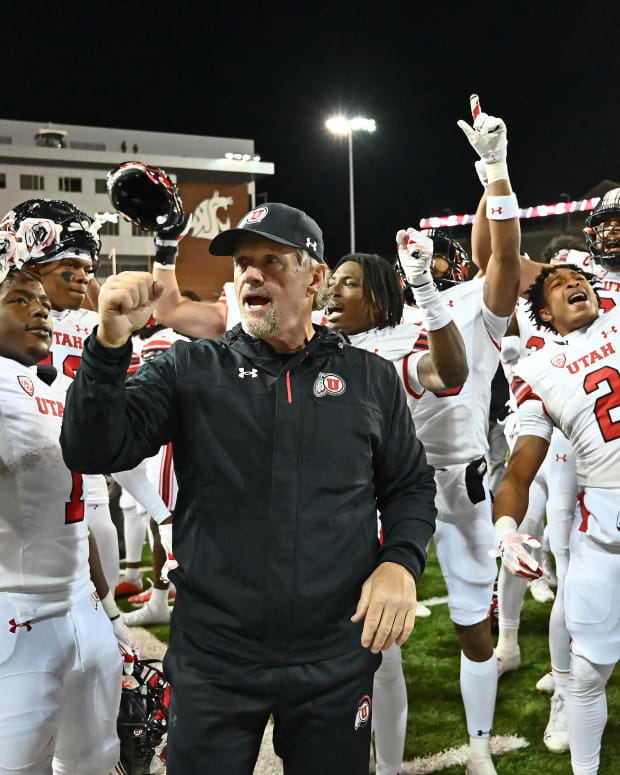 Utah Utes head coach Kyle Whittingham sings the school fight song with his team after a game against the Washington State Cougars at Gesa Field at Martin Stadium. Utah won 21-17.