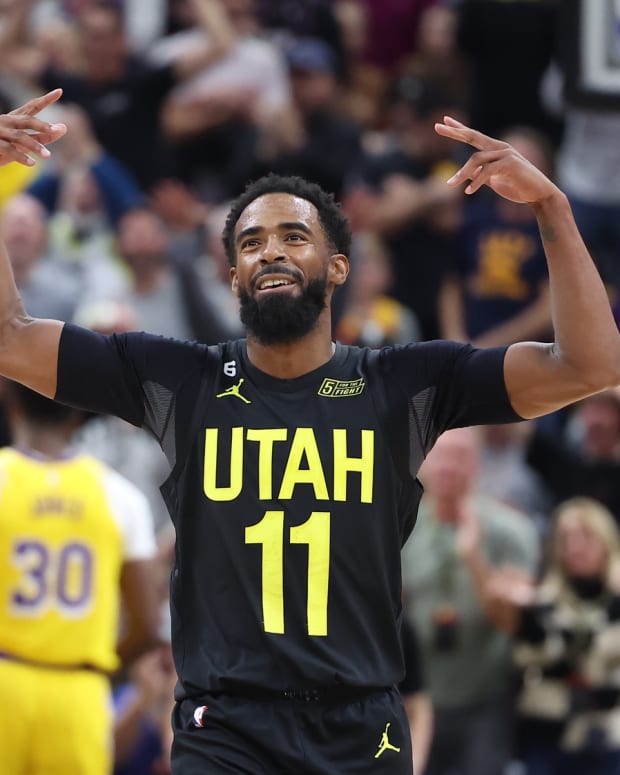 Utah Jazz guard Mike Conley (11) reacts to a play against the Los Angeles Lakers in the third quarter at Vivint Arena.