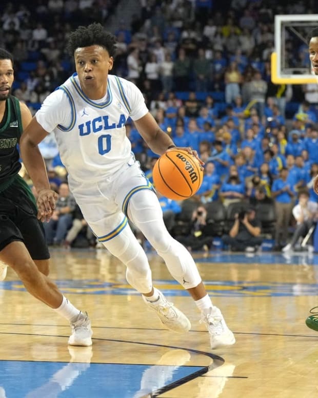 Nov 7, 2022; Los Angeles, California, USA; UCLA Bruins guard Jaylen Clark (0) dribble the ball against Sacramento State Hornets guard Zach Chappell (4) in the second half at Pauley Pavilion. Mandatory Credit: Kirby Lee-USA TODAY Sports