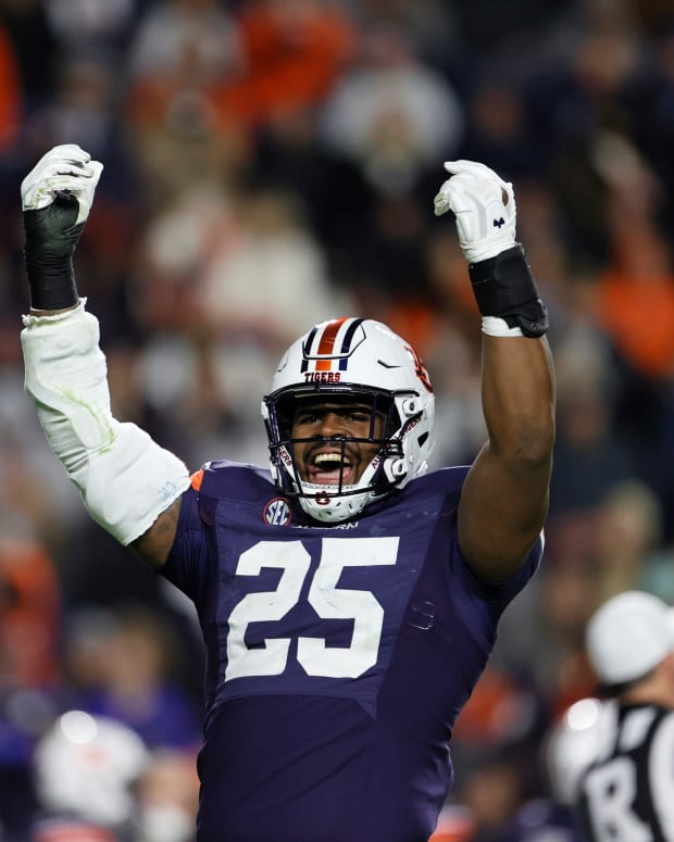 Nov 12, 2022; Auburn, Alabama, USA; Auburn Tigers defensive end Colby Wooden (25) tries to get the fans excited starting the fourth quarter against the Texas A&M Aggies at Jordan-Hare Stadium. Mandatory Credit: John Reed-USA TODAY Sports