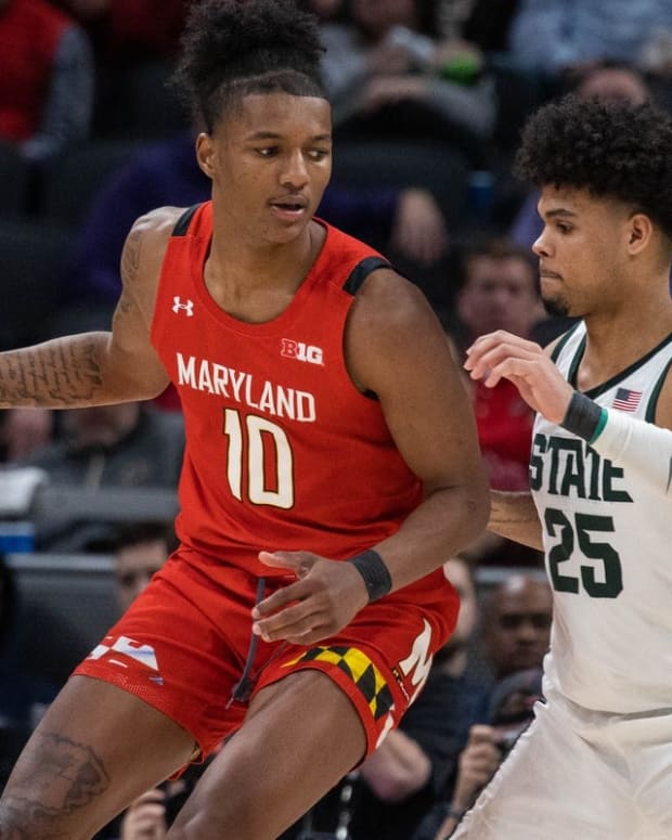 Mar 10, 2022; Indianapolis, IN, USA; Maryland Terrapins forward Julian Reese (10) dribbles the ball while Michigan State Spartans forward Malik Hall (25) defends in the second half at Gainbridge Fieldhouse. Mandatory Credit: Trevor Ruszkowski-USA TODAY Sports