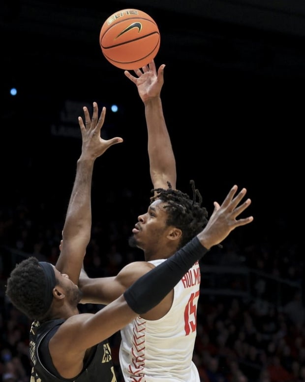 Nov 7, 2022; Dayton, Ohio, USA; Dayton Flyers forward DaRon Holmes II (15) dribbles the ball against Lindenwood Lions forward Remy Lemovou (42) in the first half at University of Dayton Arena. Mandatory Credit: Aaron Doster-USA TODAY Sports
