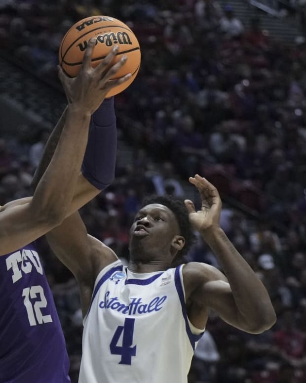 Mar 18, 2022; San Diego, CA, USA; TCU Horned Frogs forward Xavier Cork (12) shoots the basketball against Seton Hall Pirates forward Tyrese Samuel (4) during the first half during the first round of the 2022 NCAA Tournament at Viejas Arena. Mandatory Credit: Kirby Lee-USA TODAY Sports