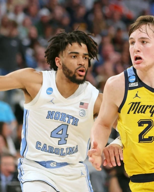 Mar 17, 2022; Fort Worth, TX, USA; Marquette Golden Eagles guard Tyler Kolek (22) dribbles the ball against North Carolina Tar Heels guard R.J. Davis (4) during the first half during the first round of the 2022 NCAA Tournament at Dickies Arena. Mandatory Credit: Kevin Jairaj-USA TODAY Sports