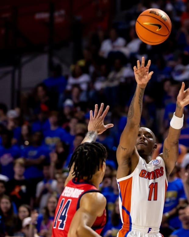 Nov 7, 2022; Gainesville, Florida, USA; Florida Gators guard Kyle Lofton (11) shoots over Stony Brook Seawolves guard Tyler Stephenson-Moore (14) during the second half at Exactech Arena at the Stephen C. O'Connell Center. Mandatory Credit: Matt Pendleton-USA TODAY Sports