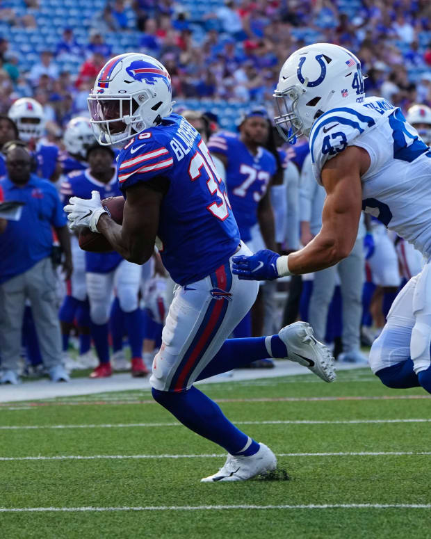 Aug 13, 2022; Orchard Park, New York, USA; Buffalo Bills running back Raheem Blackshear (35) makes a catch with Indianapolis Colts safety Trevor Denbow (43) defending during the second half at Highmark Stadium.
