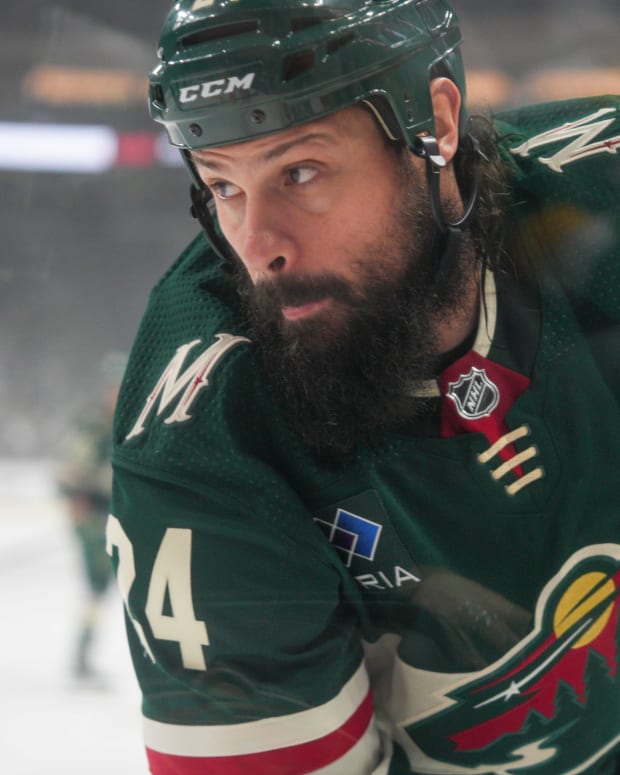 Mar 3, 2024; Saint Paul, Minnesota, USA; Minnesota Wild defenseman Zach Bogosian (24) plays the puck in his defensive zone against the San Jose Sharks in the first period at Xcel Energy Center.