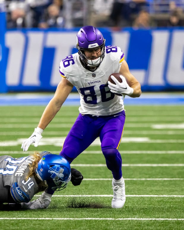 Jan 7, 2024; Detroit, Michigan, USA; Detroit Lions linebacker Alex Anzalone (34) dives and tackles Minnesota Vikings tight end Johnny Mundt (86) during second half at Ford Field.