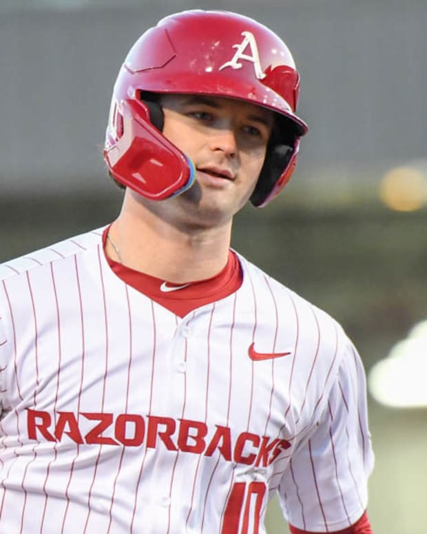 Razorbacks' Peyton Stovall rounds the bases after homer against McNeese State