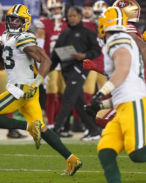 Green Bay Packers running back Aaron Jones (33) picks up 53 yards on a run during the fourth quarter of their NFC divisional playoff game against the San Francisco 49ers Saturday, Jan. 20, 2024, at Levi Stadium in Santa Clara, Calif. The 49ers beat the Packers 24-21.