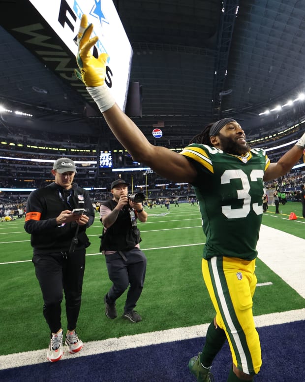 Jan 14, 2024; Arlington, Texas, USA; Green Bay Packers running back Aaron Jones (33) reacts after defeating the Dallas Cowboys in the 2024 NFC wild card game at AT&T Stadium.