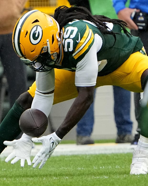 Green Bay Packers linebacker De'Vondre Campbell (59) recovers a fumble by Los Angeles Rams quarterback Brett Rypien during the first quarter of their game at Lambeau Field Sunday, November 5, 2023 in Green Bay, Wisconsin.