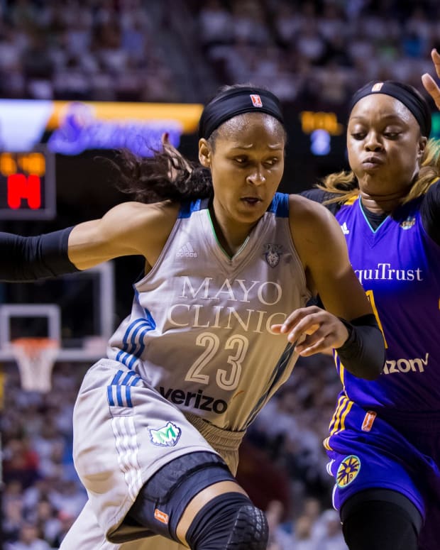 Oct 4, 2017; Minneapolis, MN, USA; Minnesota Lynx forward Maya Moore (23) dribbles in the first quarter against the Los Angeles Sparks guard Odyssey Sims (1) in Game 5 of the WNBA Finals at Williams Arena.