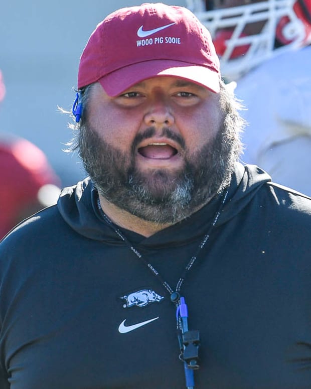 Razorbacks offensive line coach Cody Kennedy during drills Tuesday morning