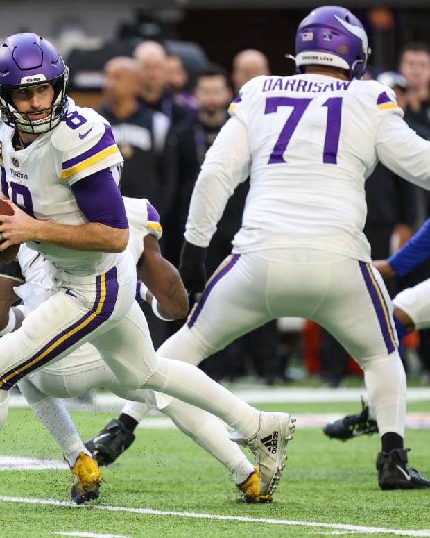 Dec 24, 2022; Minneapolis, Minnesota, USA; Minnesota Vikings quarterback Kirk Cousins (8) drops to pass against the New York Giants during the first quarter at U.S. Bank Stadium.