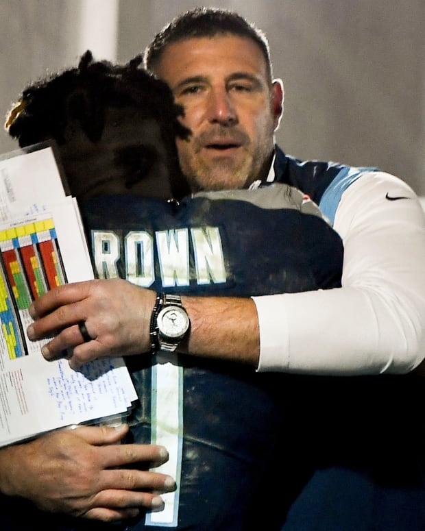 Tennessee Titans head coach Mike Vrabel hugs wide receiver A.J. Brown (11) after they beat the 49ers at Nissan Stadium Thursday, Dec. 23, 2021 in Nashville, Tenn.
