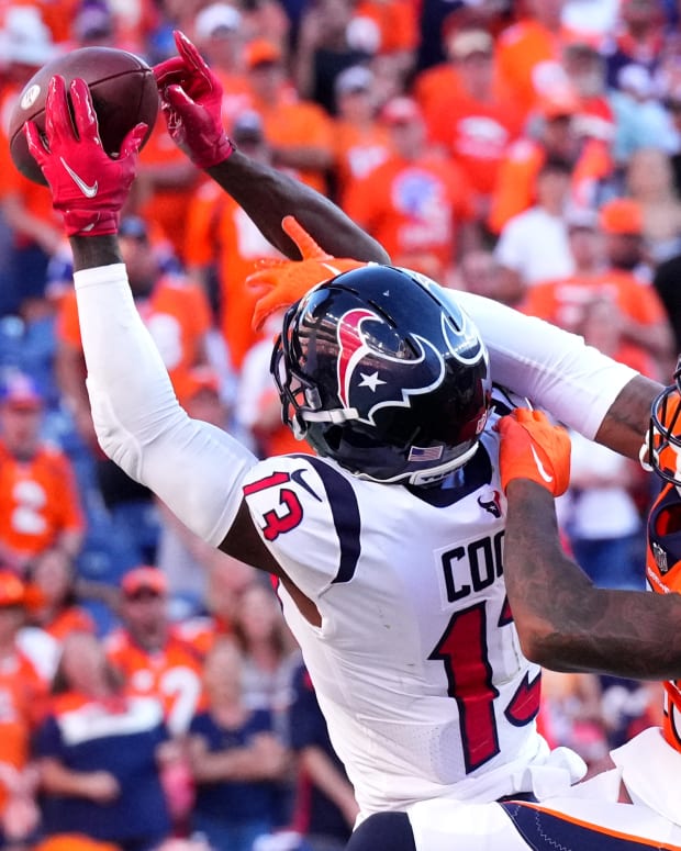 Houston Texans receiver Brandin Cooks (13) attempting to make a catch against the Denver Broncos.