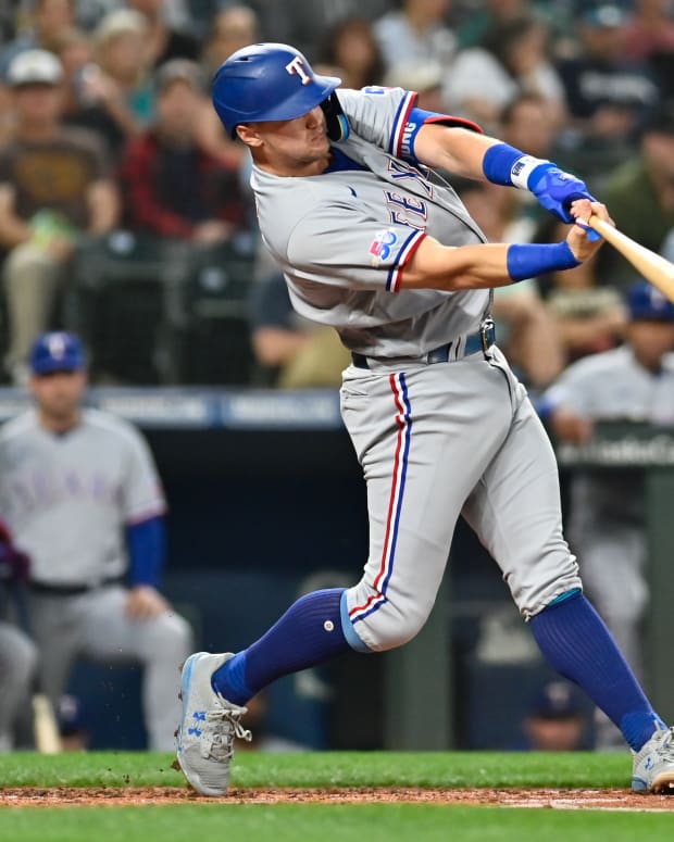 Sep 27, 2022; Seattle, Washington, USA; Texas Rangers third baseman Josh Jung (6) hits a home run against the Seattle Mariners during the second inning at T-Mobile Park. Mandatory Credit: Steven Bisig-USA TODAY Sports