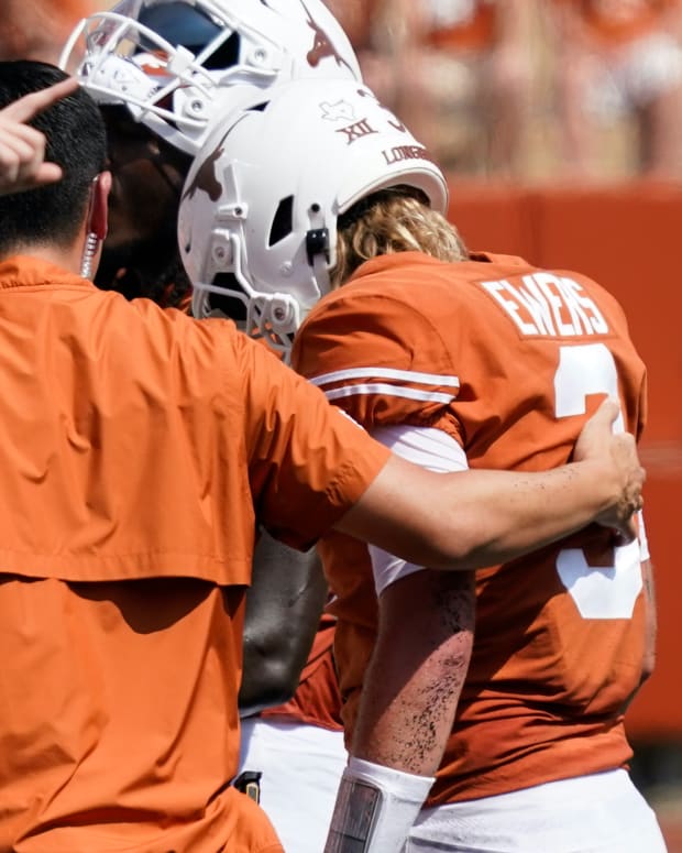 Texas Longhorns quarterback Quinn Ewers (3) walks off the field after getting hit while throwing a pass against the Alabama Crimson Tide during the first half at at Darrell K Royal-Texas Memorial Stadium